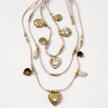 Collana cordino a tre fili con charms in acciaio inox