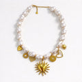 Collana in acciaio inox con perle e charms oro