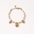 Bracciale in acciaio inox con perle e cuori pendenti